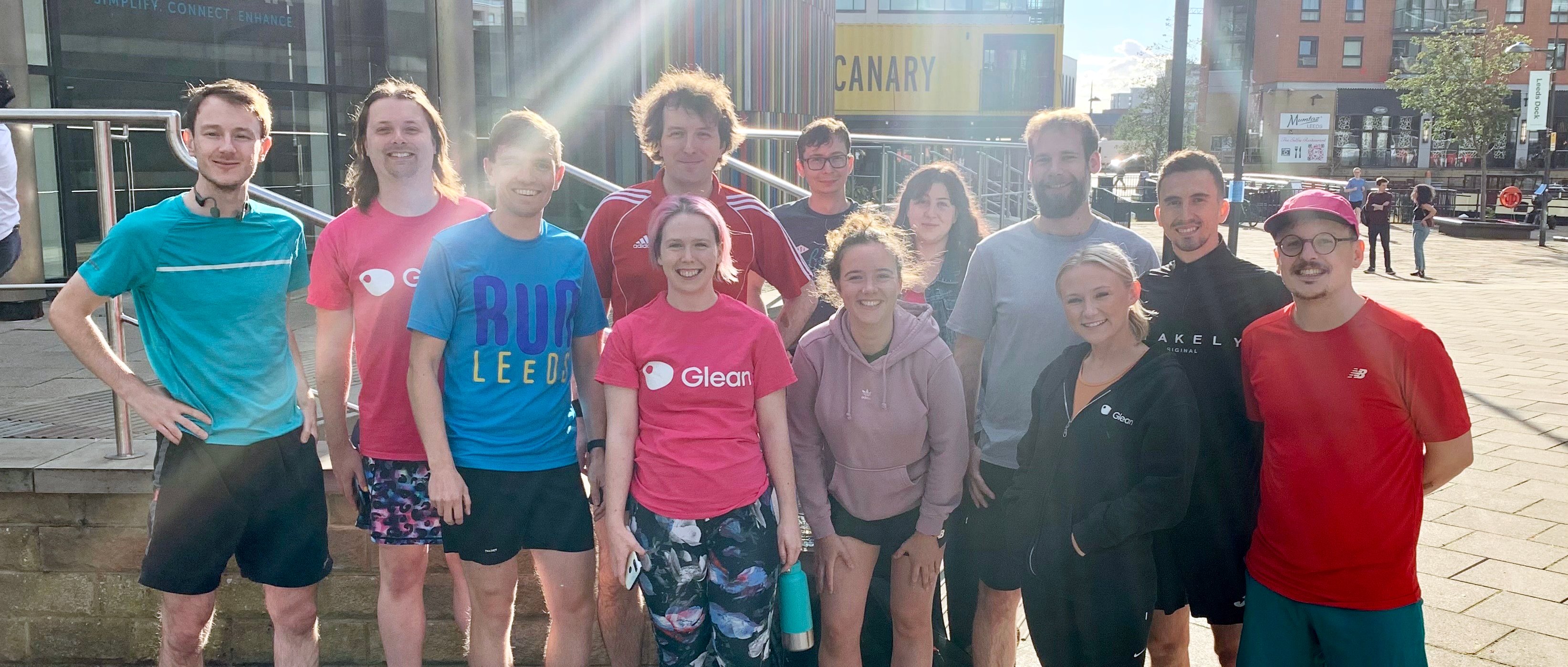 Image Of A Group Of People In Sports Gear Smiling At The Camera